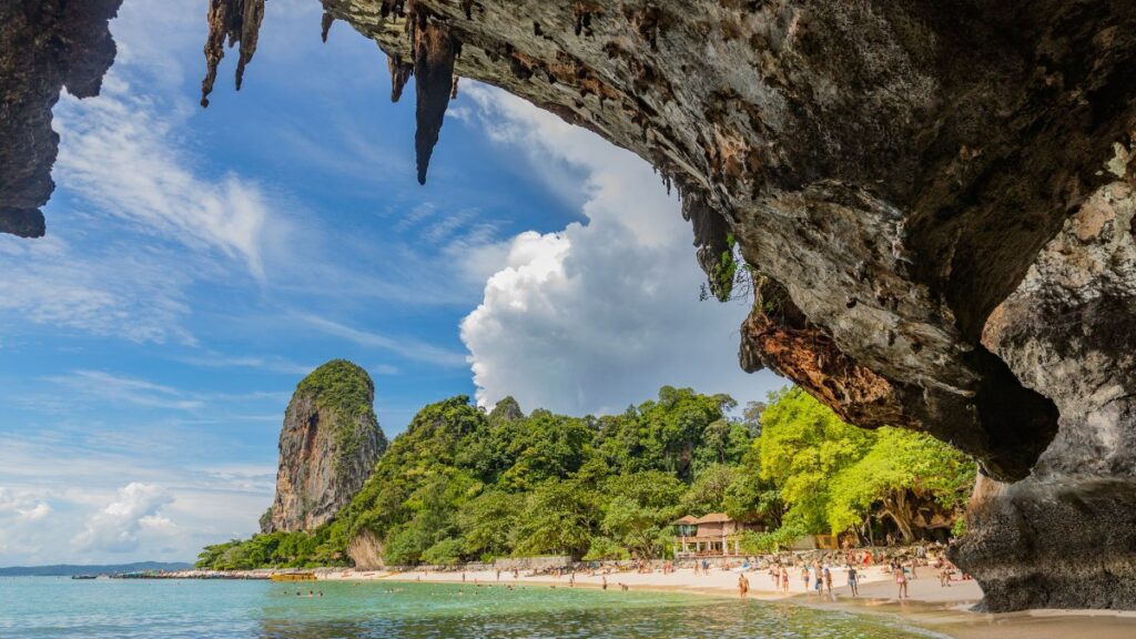 Beachgoers enjoy Phra Nang Cave Beach in Krabi, Thailand